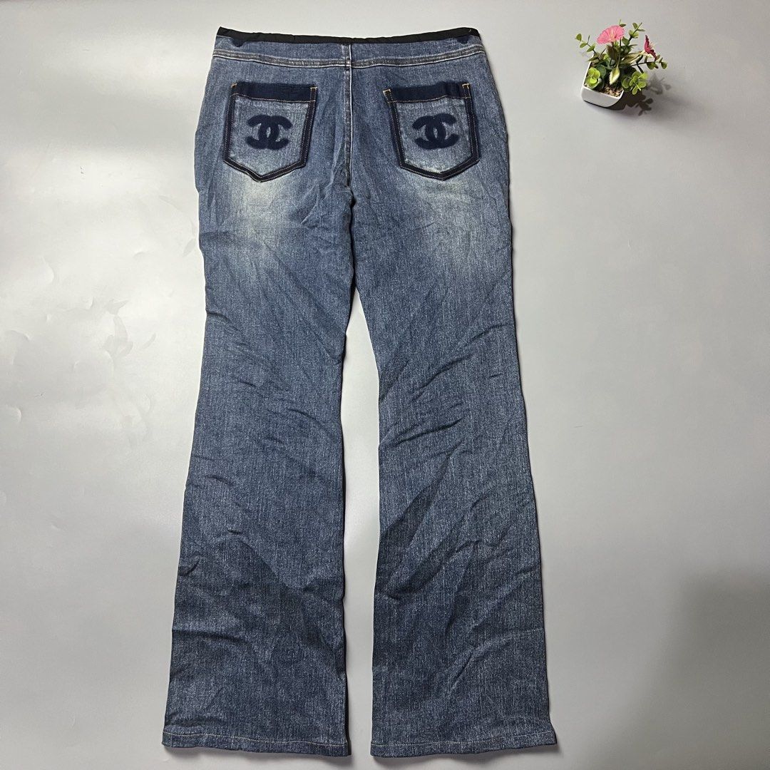Chanel Blue Denim Jeans with CC Logo (Category: Jeans) located in Bago City. Submitted by g___shop (Listing ID 1451034971, Image 2). Description: - Iconic Chanel blue denim jeans - Signature CC logo embroidered on back pockets - Classic button and zip fly closure - Trendy flare leg silhouette - Stylish slit detail at the hem - Authentic Made in Italy craftsmanship - Elevate your casual wardrobe with a touch of luxury.