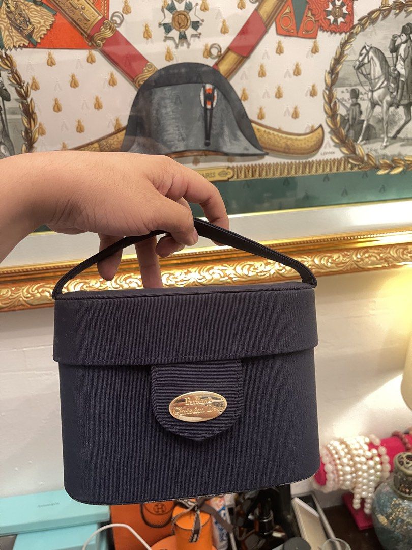 Christian Dior Vanity Case Navy Blue (Category: Luxury Bags & Wallets) located in Marilao. Submitted by wardrovearchives (Listing ID 1451062648, Image 1). Description: - Navy blue Christian Dior vanity case - Features a convenient top handle - Interior marked 'Trousse de Toilette' - Ideal for storing makeup or toiletries - Compact and small size.