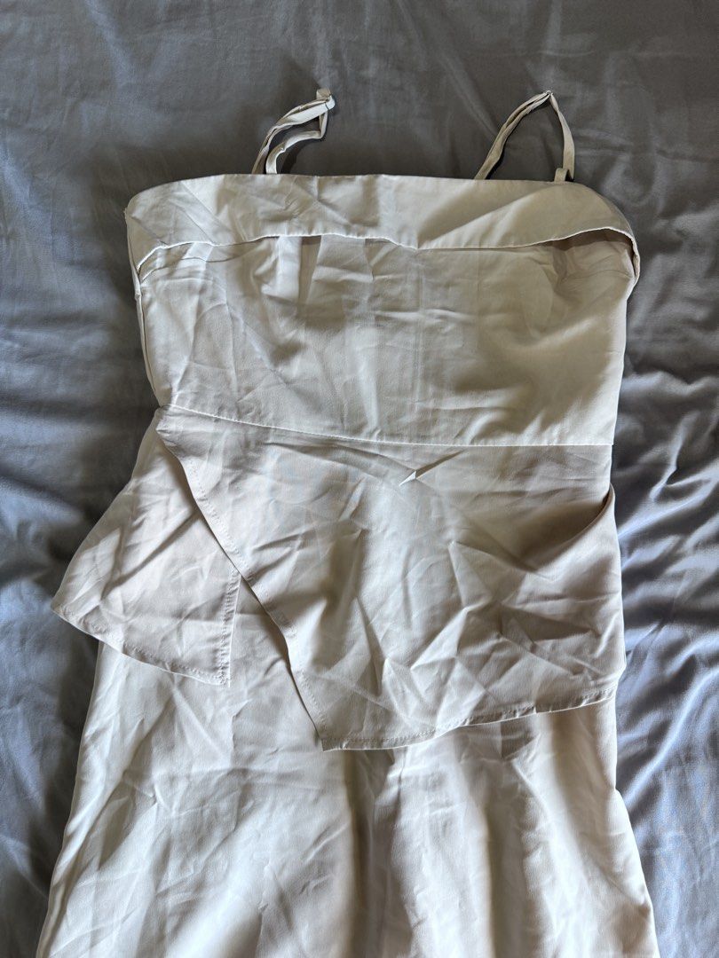 Cream Strappy Peplum Dress (Category: Sets or Coordinates) located in Pasay City. Submitted by idaboutique (Listing ID 1451063922, Image 3). Description: - Cream midi dress - Spaghetti straps - Peplum waist - Satin-like material - Black jogger pants - Elastic waistband - Pockets - Versatile for casual or dressed-up looks.