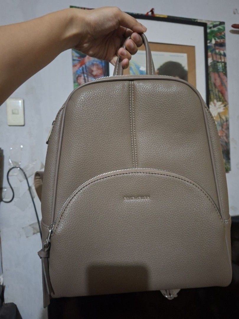 David Jones Supple Pebble PU Leather Backpack (Category: Backpacks) located in Manila. Submitted by singlepringle (Listing ID 1451065313, Image 1). Description: - Brand: David Jones - Color: Taupe - Material: Pebble leather texture - Compartments: Main zip compartment, front zip pocket - Straps: Adjustable - Handle: Top handle for carrying - Ideal for: Everyday use.
