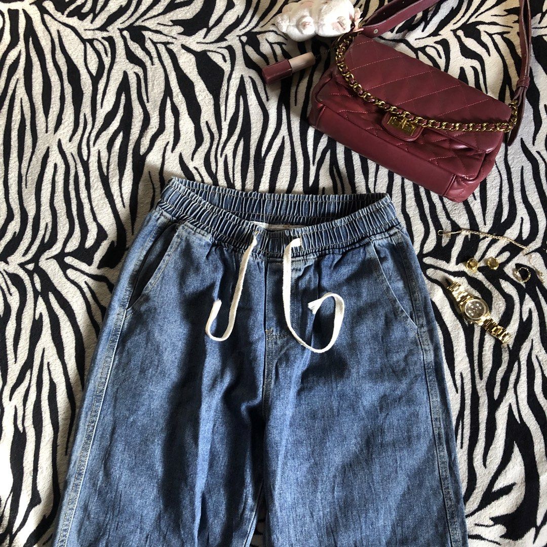 Denim Jeans with Elastic Waistband and Drawstring (Category: Jeans) located in Muntinlupa City. Submitted by ksclocollection (Listing ID 1451063391, Image 1). Description: Comfy blue denim wide-leg jeans with elastic waistband and drawstring. Front pockets. Perfect for casual outfits. waist 26-30 girlies length 40.