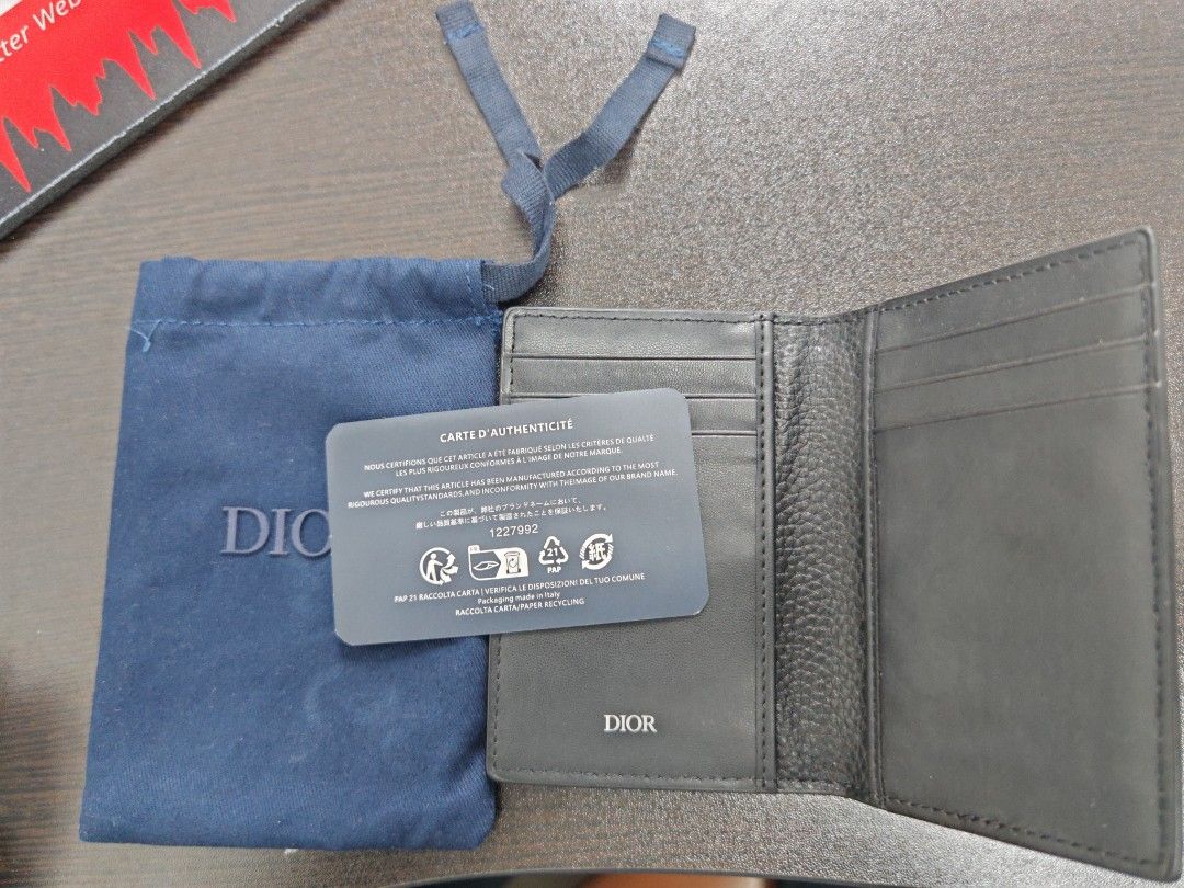 Dior Bifold Wallet Black Leather (Category: Luxury Bags & Wallets) located in Pasig City. Submitted by EntreChamp (Listing ID 1450964195, Image 1). Description: - Authentic Dior bifold wallet - Material: Black pebbled leather - Features: Multiple card slots, classic CD logo on front - Includes: Dust bag, authenticity card - Ideal for: Everyday use, keeping cards and cash organized in style.