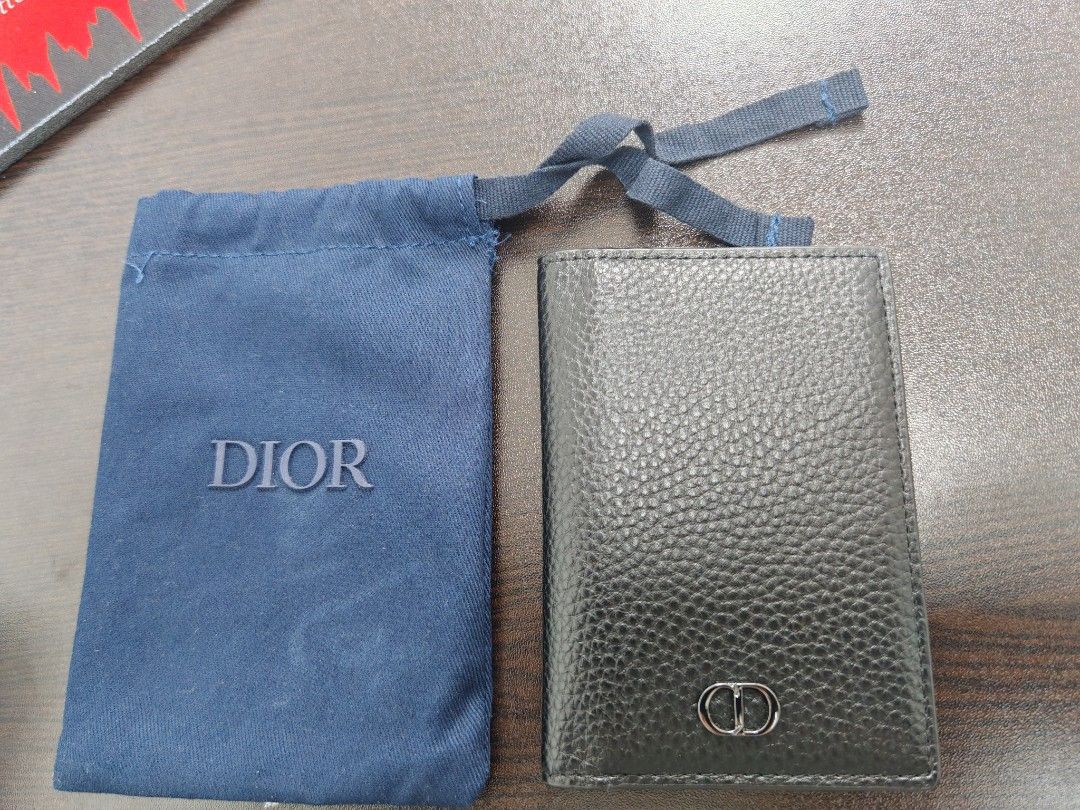 Dior Bifold Wallet Black Leather (Category: Luxury Bags & Wallets) located in Pasig City. Submitted by EntreChamp (Listing ID 1450964195, Image 3). Description: - Authentic Dior bifold wallet - Material: Black pebbled leather - Features: Multiple card slots, classic CD logo on front - Includes: Dust bag, authenticity card - Ideal for: Everyday use, keeping cards and cash organized in style.