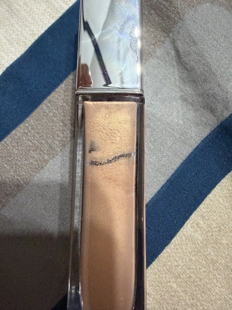 Dior Gold Illuminator / Liquid Highlighter (Category: Makeup) located in Quezon City. Submitted by glitchandglamor (Listing ID 1451093269, Image 3). Description: •RFS: downsizing collection, opened in 10/2024, buy at your own risk, still smells like Dior’s signature elegant, powdery, and floral scent for the makeup • 80% product left.