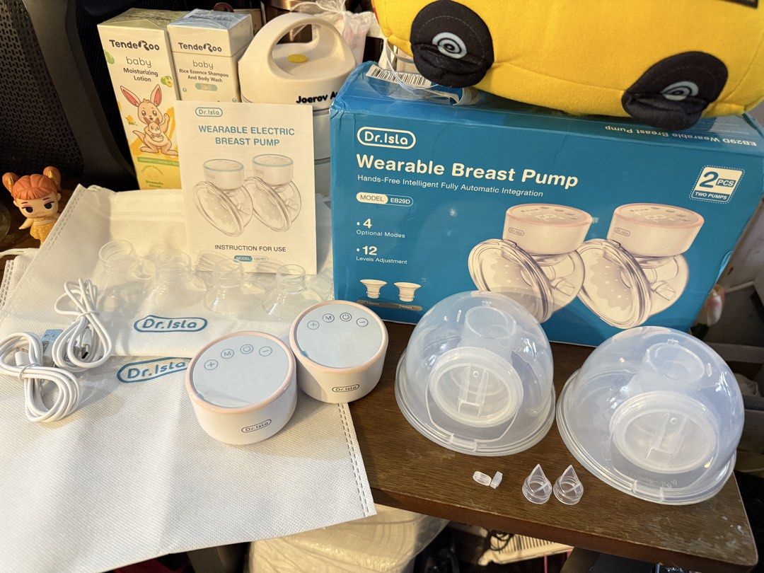 Dr. Isla Wearable Electric Breast Pump EB29D (Category: Breastfeeding & Bottle Feeding) located in Taguig. Submitted by jaja.17 (Listing ID 1450994305, Image 2). Description: - Dr. Isla Wearable Electric Breast Pump (Model EB200) - Hands-free design for ultimate convenience - 4 adjustable modes - 12 suction level adjustments - Includes instruction manual and charging cable - All parts shown in photos - Ideal for pumping on the go.