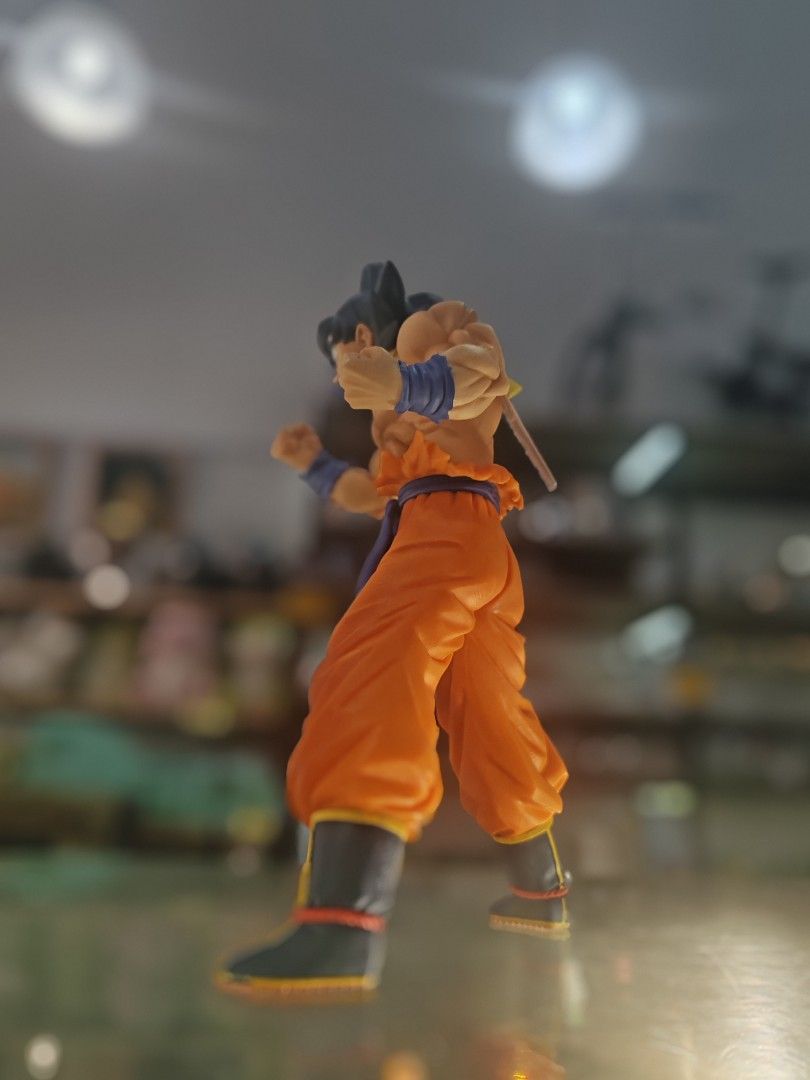 Dragon Ball Z Goku Action Figure (Category: Toys & Games) located in Kuala Lumpur. Submitted by iskandarkhan (Listing ID 1450977639, Image 2). Description: - Dragon Ball Z Goku action figure - Iconic orange gi with blue sash - Features detailed muscles and spiky hair - Posed dynamically, ready for battle - Comes with original tag attached - Essential for any Dragon Ball fan's collection.
