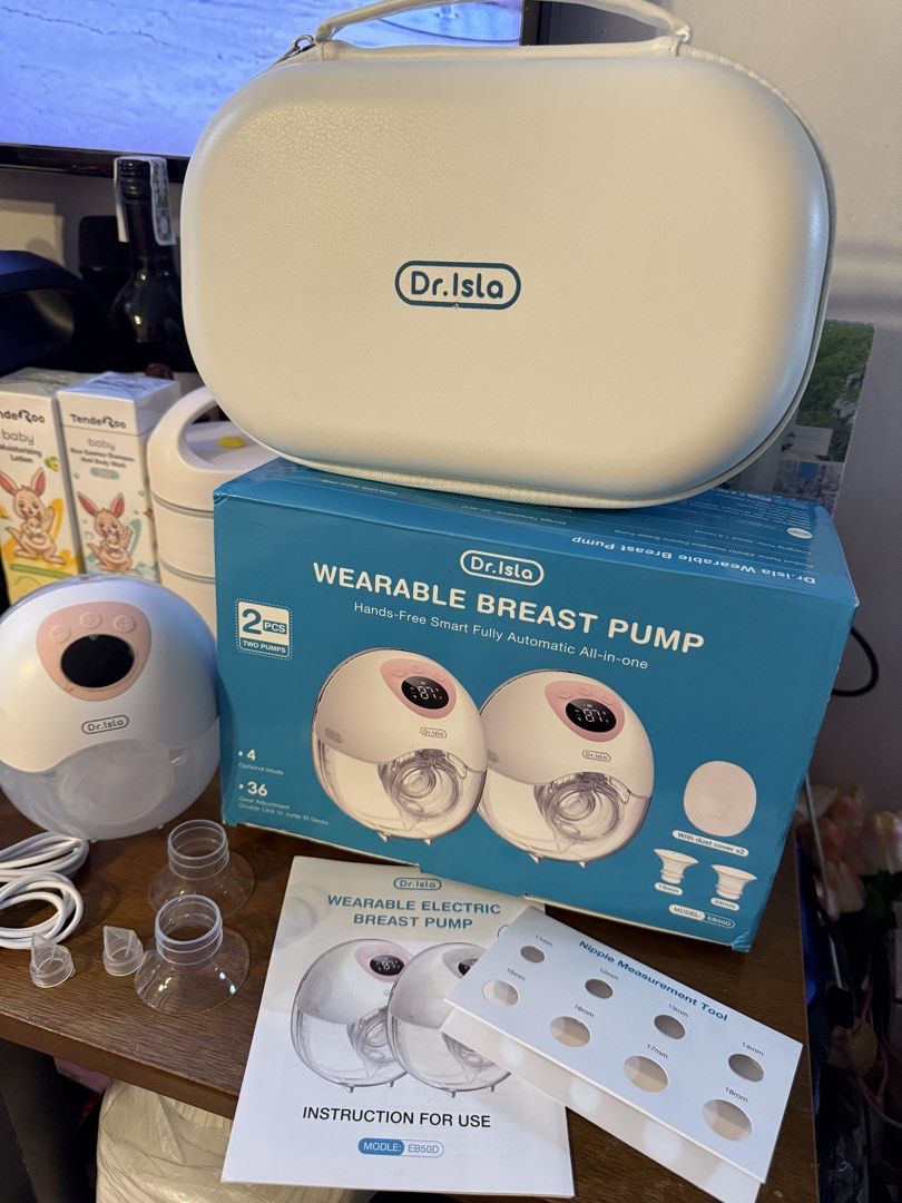 dr.isla Wearable Smart Fully Automatic Breast Pump (Category: Breastfeeding & Bottle Feeding) located in Taguig. Submitted by jaja.17 (Listing ID 1450995021, Image 2). Description: - Dr. Isla Wearable Breast Pump Set (Sobrang ganda ng suction neto, used only for a few times humina breast milk ko kaya need na ibenta, need funds) - Hands-free design for ultimate convenience - Includes two breast pumps - Comes with charging cable and essential acces