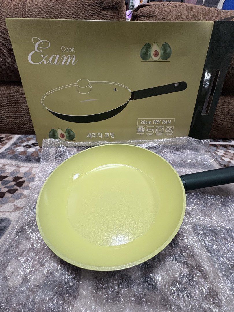 Ezam Cook 28cm Ceramic Coating Fry Pan (Category: Cookware & Accessories) located in Pasig City. Submitted by anenri (Listing ID 1450984346, Image 1). Description: - Brand New Ezam Cook Fry Pan - 28cm size - Durable ceramic coating - Ideal for everyday cooking - Induction stove compatible - Comes with a clear glass lid - Stylish light yellow color.