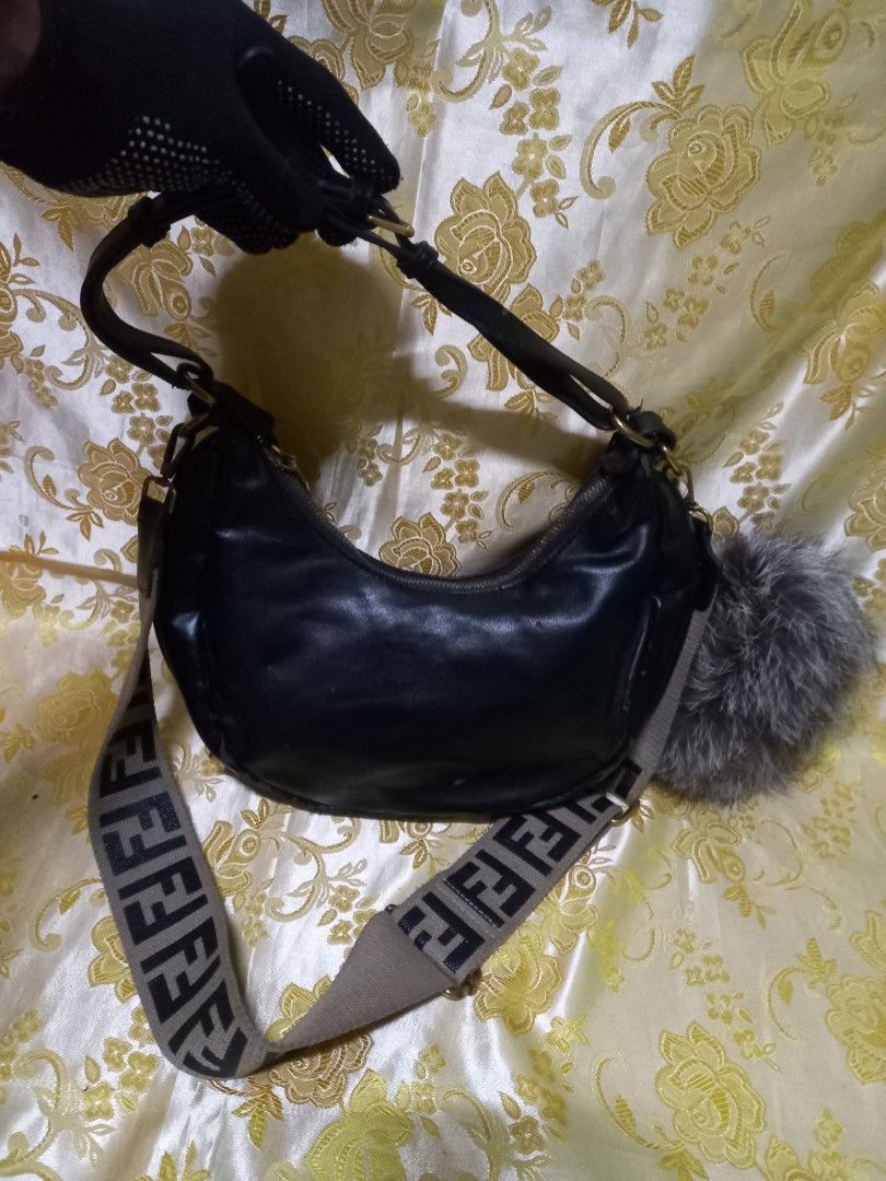 FENDI SHOULDER BAG NEED RESTORATION (Category: Luxury Bags & Wallets) located in Manila. Submitted by cristobalc40322 (Listing ID 1413041616, Image 3). Description: - Authentic Fendi shoulder bag - Black exterior with gold FENDI lettering - Features a brown and black Fendi logo strap - Red interior with zipper closure - Includes Fendi Roma tag and QR code tag COMPLETE AND ORIGINAL BUT NEED TO RESTORE STILL DURABLE LIGHTLY USED HINDE LANG NAITABI 