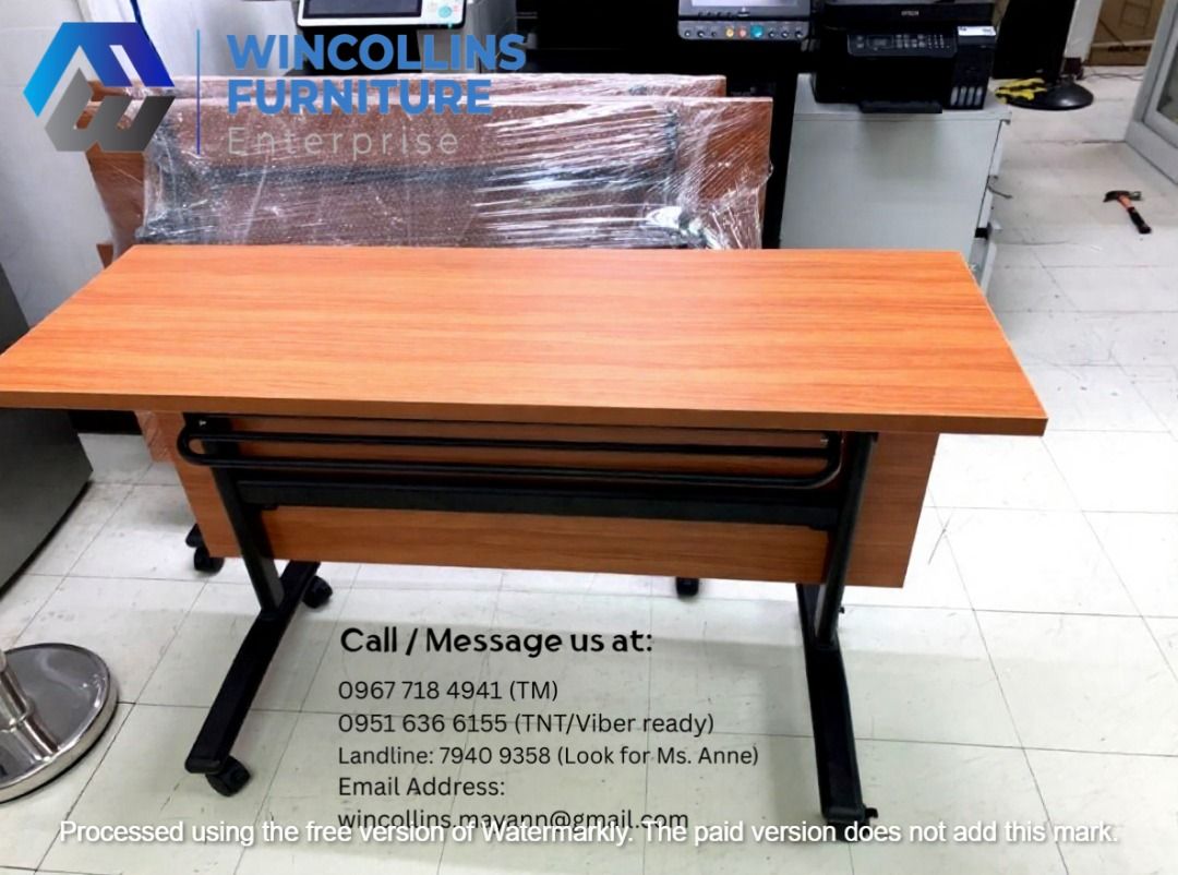 Folding Training Table / Study Table / Work Table (Category: Tables & Sets) located in Manila. Submitted by wincollinsmayannrc (Listing ID 1450939701, Image 2). Description: Folding Training Table / Office Table Melamine scratch proof table top and modesty With 2nd layer shelf Black Tubular legs with caster wheels Color: Off White.