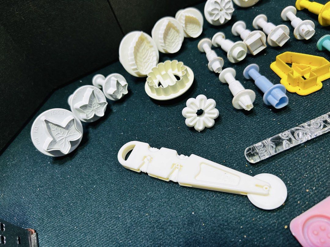 Fondant Cutters Molds Set for Cake Decorating (Category: Bakeware) located in Manila. Submitted by starbalesukandjapansurplus (Listing ID 1451129393, Image 2). Description: - Extensive fondant cutter and mold collection. - Features butterflies, leaves, flowers, and letters. - Includes a small rolling pin. - Comes with various round cutters. - Ideal for baking and cake decorating. - All items pictured are included. - Perfect for adding intricate d