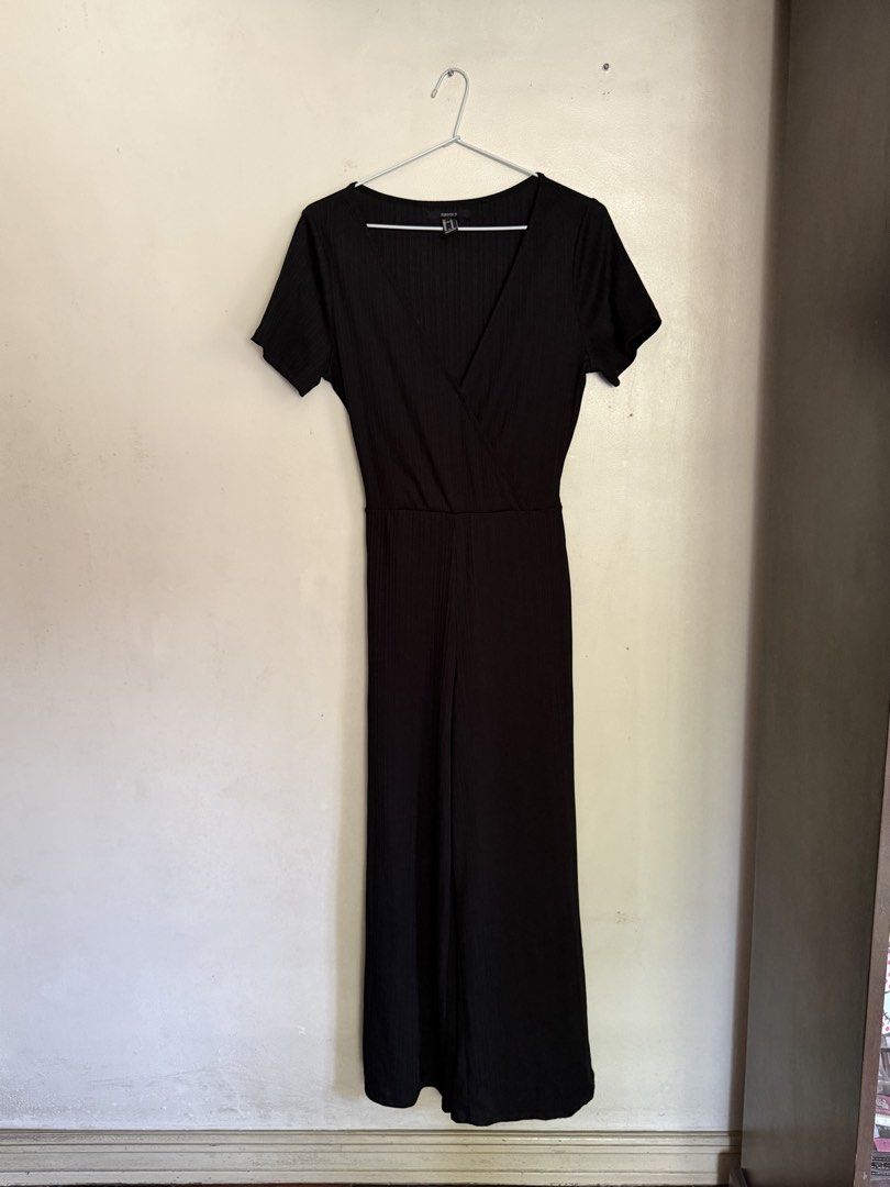 Forever 21 Black Ribbed Wrap Jumpsuit Size M (Category: Jumpsuits) located in Angeles City. Submitted by endzn (Listing ID 1451012867, Image 1). Description: - Black ribbed jumpsuit from Forever 21 - Short sleeves and V-neck wrap style - Wide leg pants - Comes with a tie belt - Perfect for dressing up or down - Comfortable and stylish.