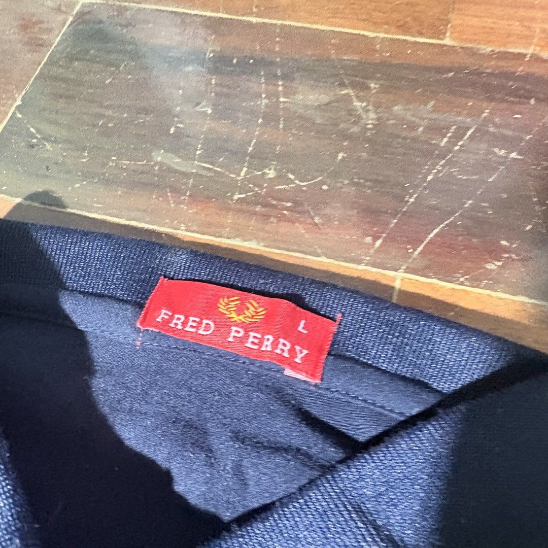 Fred Perry Navy Blue Polo Shirt (Category: Shirts) located in Mandaluyong City. Submitted by aestephics (Listing ID 1451006872, Image 2). Description: rfs need student funds! for inquiries, message anytime note: kindly manage your expectations for pre-loved items. loc: mandaluyong city near rtu mop gcash or maya shipping via lalamove, j&t, or angkas padala.