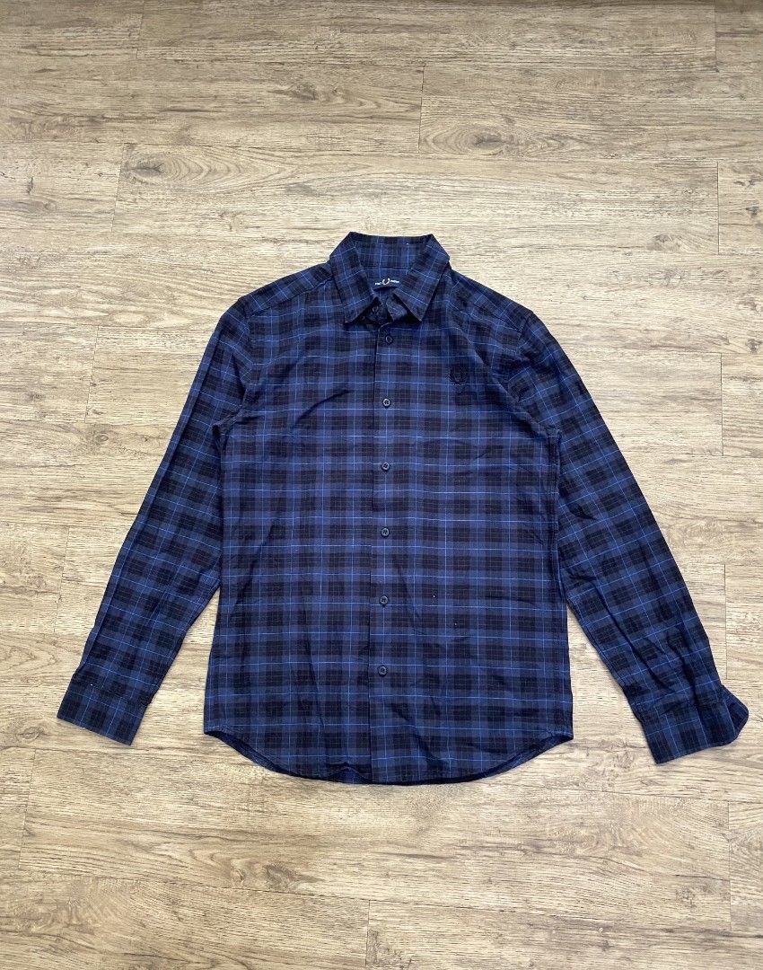 Fred Perry Plaid Long Sleeve Shirt (Category: Tshirts & Polo Shirts ) located in Cebu City. Submitted by francloset_1 (Listing ID 1451126156, Image 1). Description: - Classic blue and black plaid design - Long sleeves with button cuffs - Iconic Fred Perry laurel wreath logo embroidered on chest - Made in China - Ideal for casual wear -Dimes:W19, L28.5, arm25.