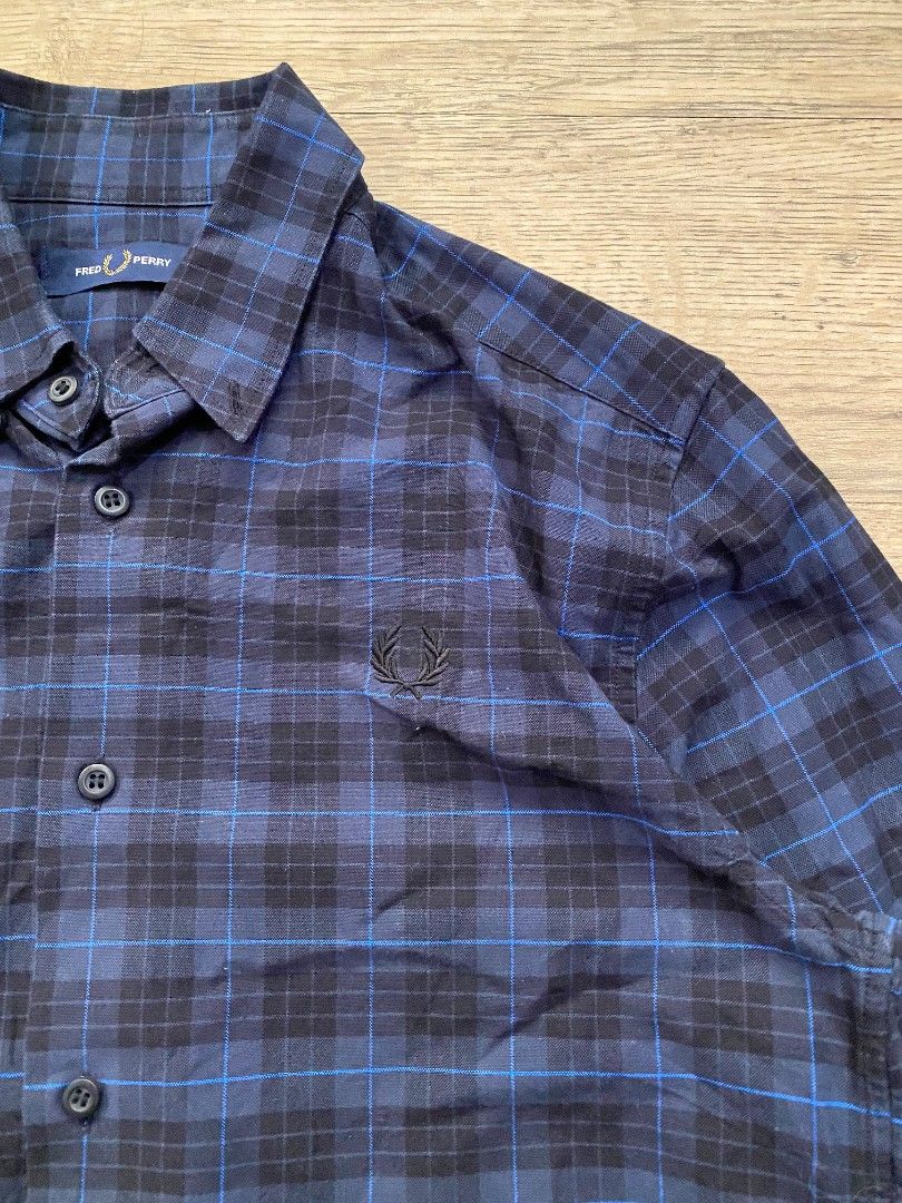 Fred Perry Plaid Long Sleeve Shirt (Category: Tshirts & Polo Shirts ) located in Cebu City. Submitted by francloset_1 (Listing ID 1451126156, Image 3). Description: - Classic blue and black plaid design - Long sleeves with button cuffs - Iconic Fred Perry laurel wreath logo embroidered on chest - Made in China - Ideal for casual wear -Dimes:W19, L28.5, arm25.
