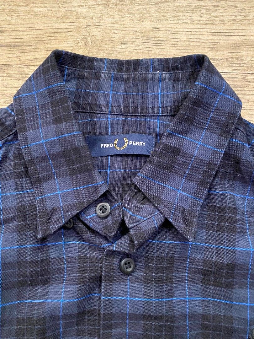 Fred Perry Plaid Long Sleeve Shirt (Category: Tshirts & Polo Shirts ) located in Cebu City. Submitted by francloset_1 (Listing ID 1451126156, Image 2). Description: - Classic blue and black plaid design - Long sleeves with button cuffs - Iconic Fred Perry laurel wreath logo embroidered on chest - Made in China - Ideal for casual wear -Dimes:W19, L28.5, arm25.