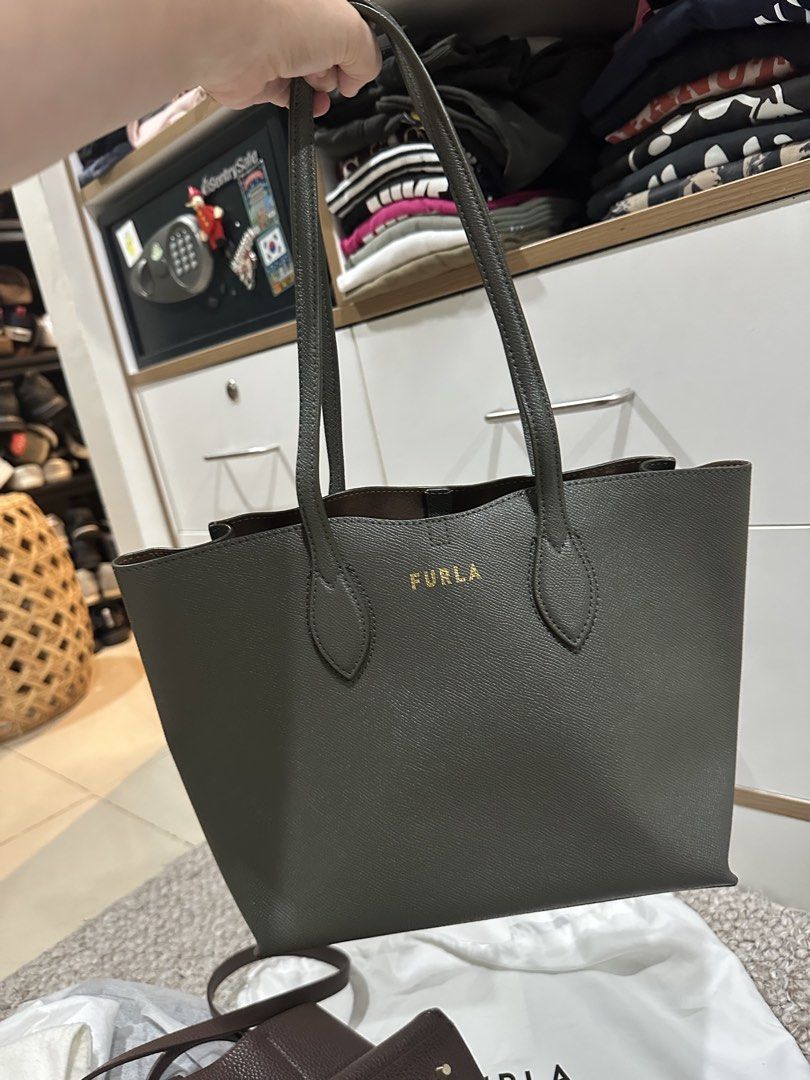 Furla Tote Bag - Green (Category: Luxury Bags & Wallets) located in Cebu City. Submitted by artitabysue (Listing ID 1450996380, Image 1). Description: - Authentic Furla tote bag - Beautiful olive green color - Genuine leather material - Comes with original dust bag and tags - Spacious interior with secure zip closure - Ideal for everyday use and travel.