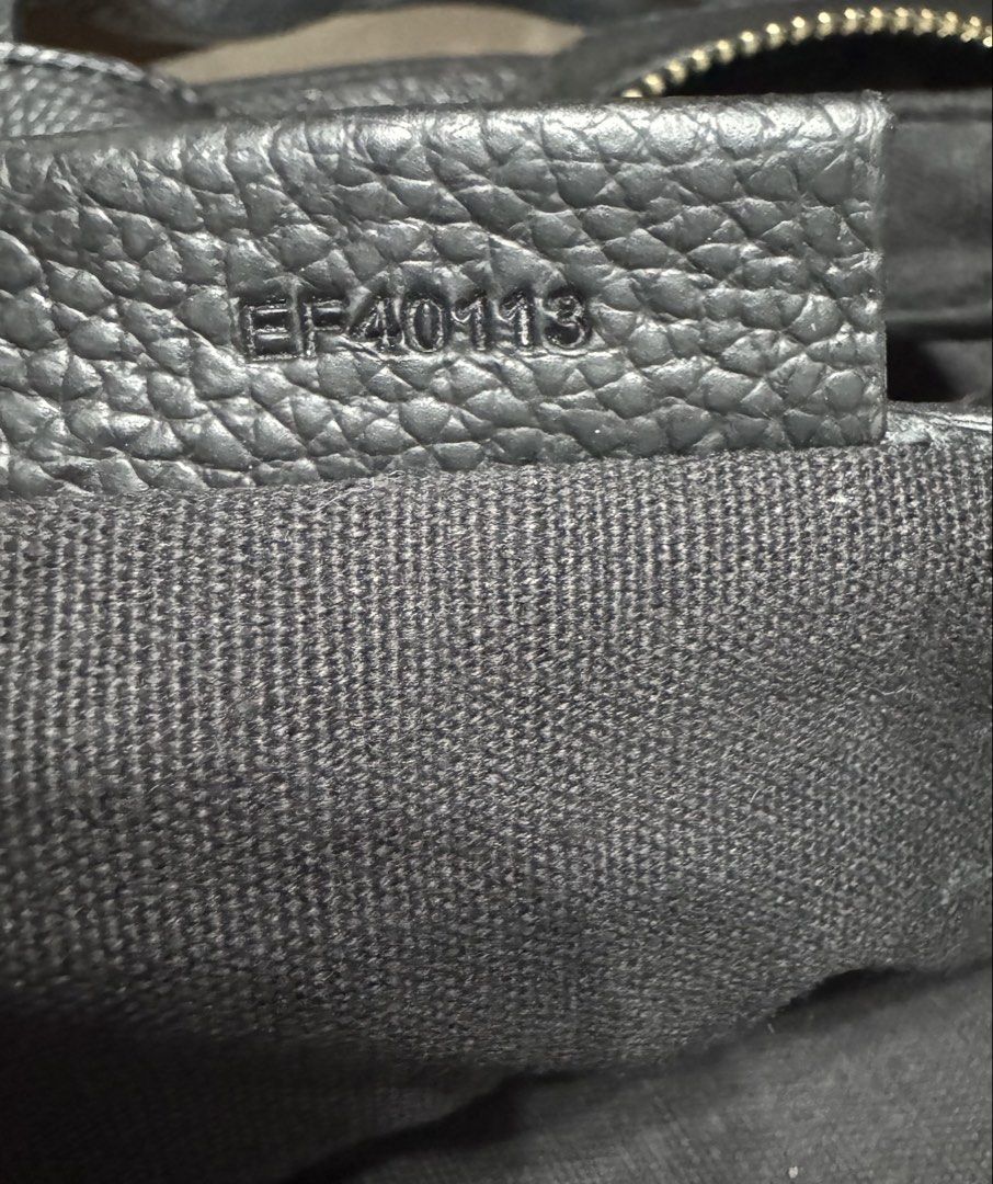 Givenchy Nightangle (Category: Luxury Bags & Wallets) located in Malolos. Submitted by urban_thrift_09 (Listing ID 1451091350, Image 3). Description: - Authentic Givenchy black leather tote bag - Made in Italy - Iconic Givenchy logo embossed on the front - Spacious interior with zip closure - Size:20”x 12”x7” - Serial number EF40113 visible.
