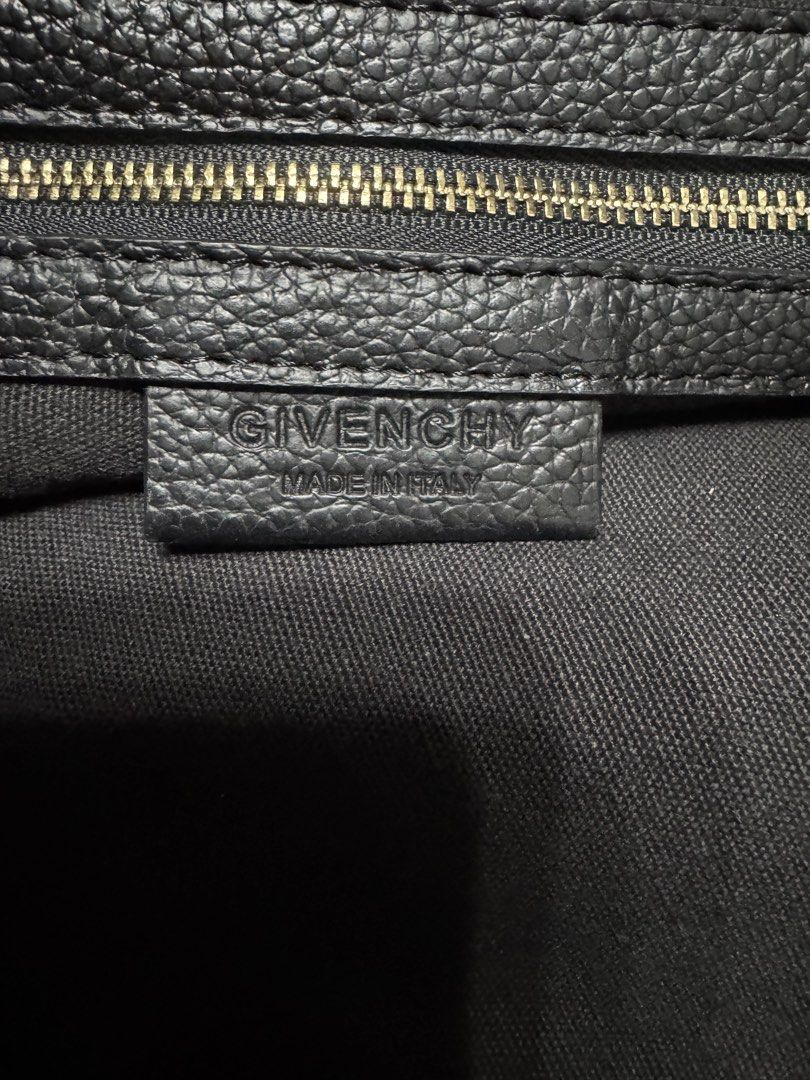 Givenchy Nightangle (Category: Luxury Bags & Wallets) located in Malolos. Submitted by urban_thrift_09 (Listing ID 1451091350, Image 2). Description: - Authentic Givenchy black leather tote bag - Made in Italy - Iconic Givenchy logo embossed on the front - Spacious interior with zip closure - Size:20”x 12”x7” - Serial number EF40113 visible.