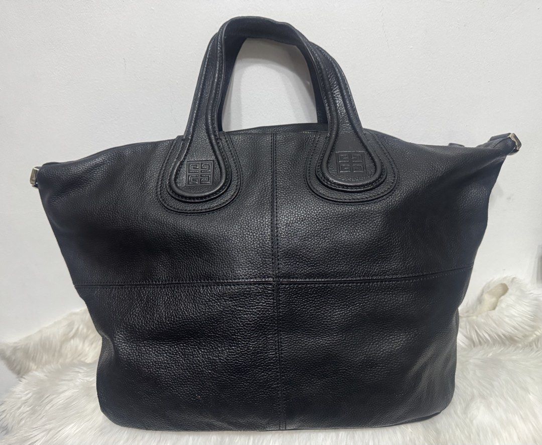 Givenchy Nightangle (Category: Luxury Bags & Wallets) located in Malolos. Submitted by urban_thrift_09 (Listing ID 1451091350, Image 1). Description: - Authentic Givenchy black leather tote bag - Made in Italy - Iconic Givenchy logo embossed on the front - Spacious interior with zip closure - Size:20”x 12”x7” - Serial number EF40113 visible.