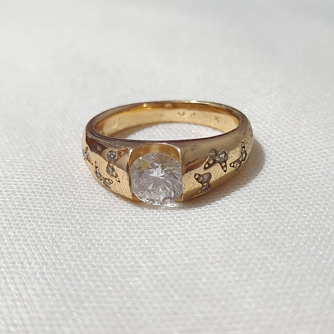 Gold Ring with Clear Stone and Butterfly Design (not real gold) (Category: Rings) located in Dasmarinas. Submitted by pb_declutters (Listing ID 1450995929, Image 2). Description: - Elegant gold ring - Features a clear stone in the center - Adorable butterfly pattern etched on the band - Size: 6 - Versatile for everyday wear or special occasions - XP Y6 engraved on band.