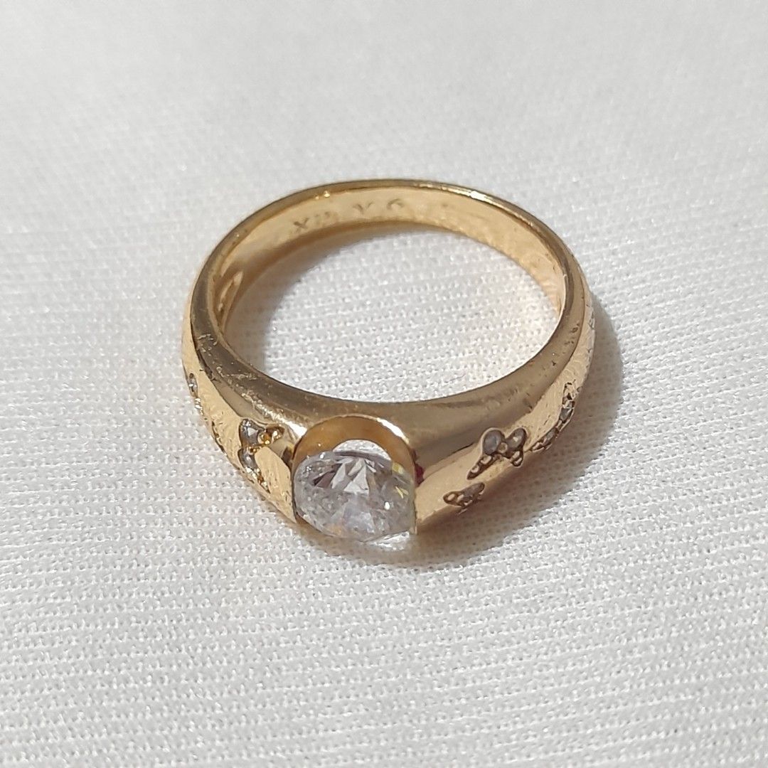 Gold Ring with Clear Stone and Butterfly Design (not real gold) (Category: Rings) located in Dasmarinas. Submitted by pb_declutters (Listing ID 1450995929, Image 1). Description: - Elegant gold ring - Features a clear stone in the center - Adorable butterfly pattern etched on the band - Size: 6 - Versatile for everyday wear or special occasions - XP Y6 engraved on band.