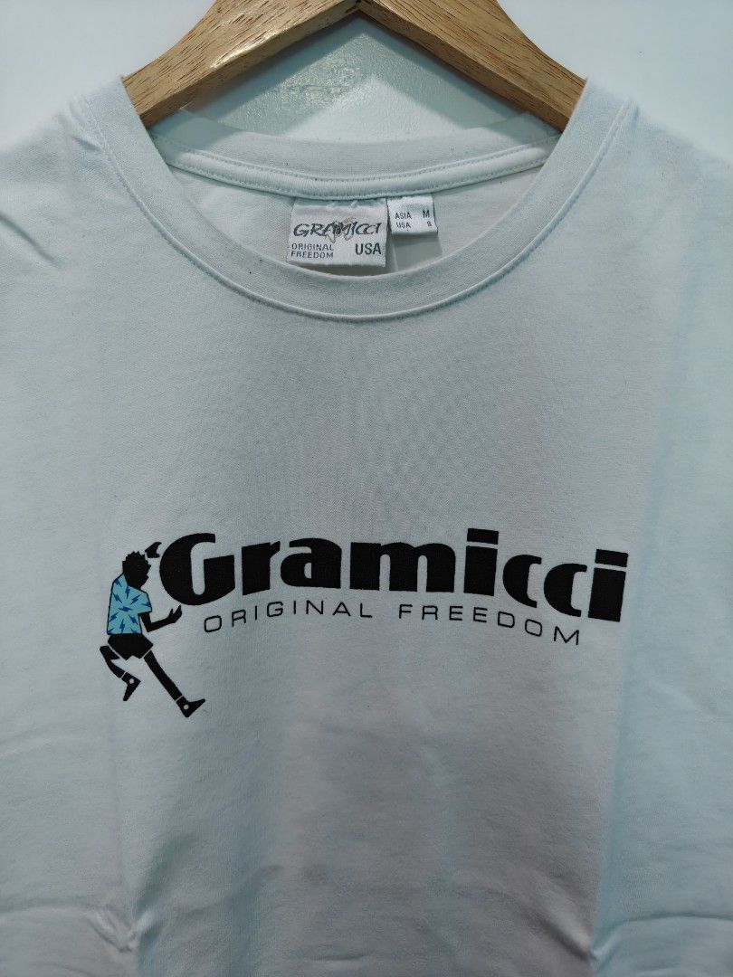 Gramicci Original Freedom T-shirt (Category: Tshirts & Polo Shirts ) located in Quezon City. Submitted by lancelooot (Listing ID 1451009965, Image 2). Description: - Brand: Gramicci - Color: White - Graphic: 'Original Freedom' with a small person icon - Size: Medium (M) 20.5x27 - Condition: Good .
