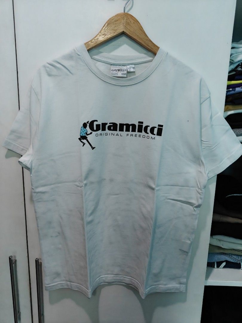 Gramicci Original Freedom T-shirt (Category: Tshirts & Polo Shirts ) located in Quezon City. Submitted by lancelooot (Listing ID 1451009965, Image 1). Description: - Brand: Gramicci - Color: White - Graphic: 'Original Freedom' with a small person icon - Size: Medium (M) 20.5x27 - Condition: Good .