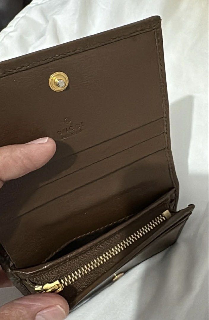 Gucci Horsebit Compact Wallet (Category: Luxury Bags & Wallets) located in Del Monte. Submitted by Machersa_20 (Listing ID 1450965869, Image 3). Description: 💯 Authentic. Money back guaranteed if proven fake. Gucci compact wallet ideal for small bags. coated canvas body with leather trim zip coin compartment trifold with snap button closure interior Condition: Excellent. This previously owned and used item is in good condition with minimal signs