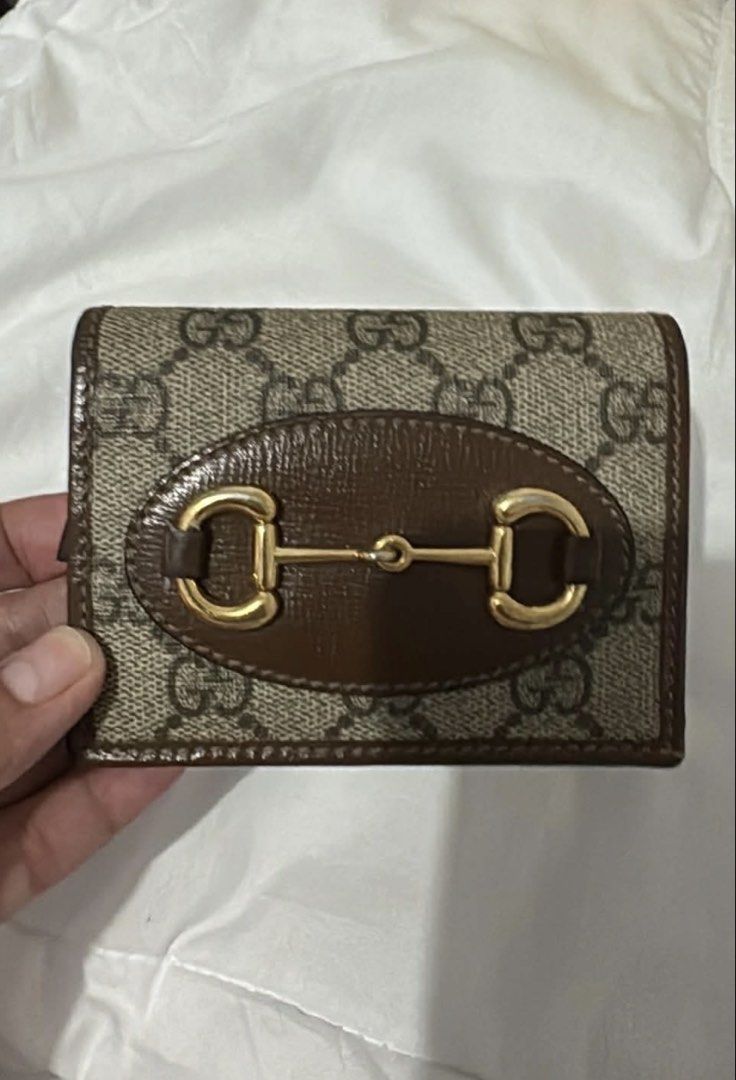 Gucci Horsebit Compact Wallet (Category: Luxury Bags & Wallets) located in Del Monte. Submitted by Machersa_20 (Listing ID 1450965869, Image 1). Description: 💯 Authentic. Money back guaranteed if proven fake. Gucci compact wallet ideal for small bags. coated canvas body with leather trim zip coin compartment trifold with snap button closure interior Condition: Excellent. This previously owned and used item is in good condition with minimal signs