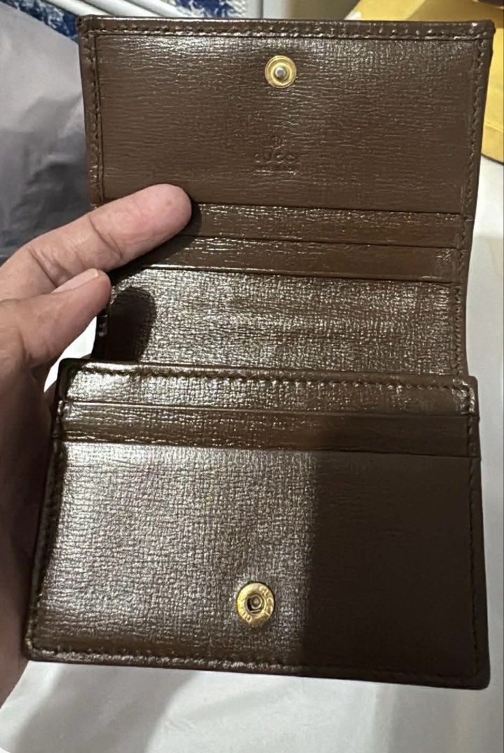 Gucci Horsebit Compact Wallet (Category: Luxury Bags & Wallets) located in Del Monte. Submitted by Machersa_20 (Listing ID 1450965869, Image 2). Description: 💯 Authentic. Money back guaranteed if proven fake. Gucci compact wallet ideal for small bags. coated canvas body with leather trim zip coin compartment trifold with snap button closure interior Condition: Excellent. This previously owned and used item is in good condition with minimal signs