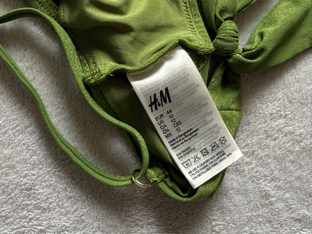H&M Green Metallic Bikini Top (Category: Bikinis & Swimsuits) located in Quezon City. Submitted by thecurvycorner (Listing ID 1450977404, Image 3). Description: - Brand: H&M - Color: Green - Size: 12 - Material: Metallic sheen fabric - Closure: Tie-back - Features: Adjustable straps .