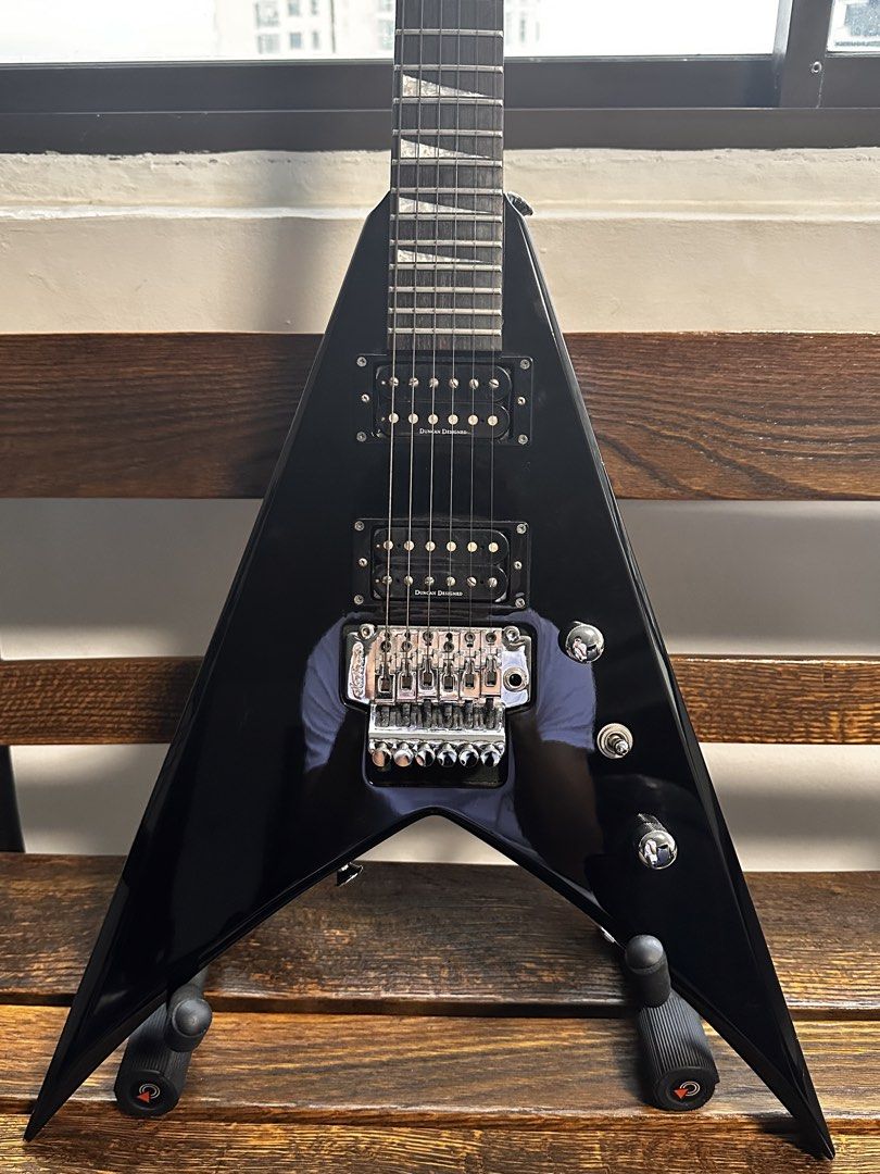 Jackson King V MIJ (Category: Musical Instruments) located in Singapore. Submitted by digsno (Listing ID 1451037708, Image 1). Description: King V Jackson KVX10 (Up to nego but no lowball) Everything in good condition aside from the small dents in the body, and paint chips on the bottom edges and the chip in the headstock. Comes with soft case as well, has a small hole in the top of the case which needs to be sewn. Neck feels brand new, fret life