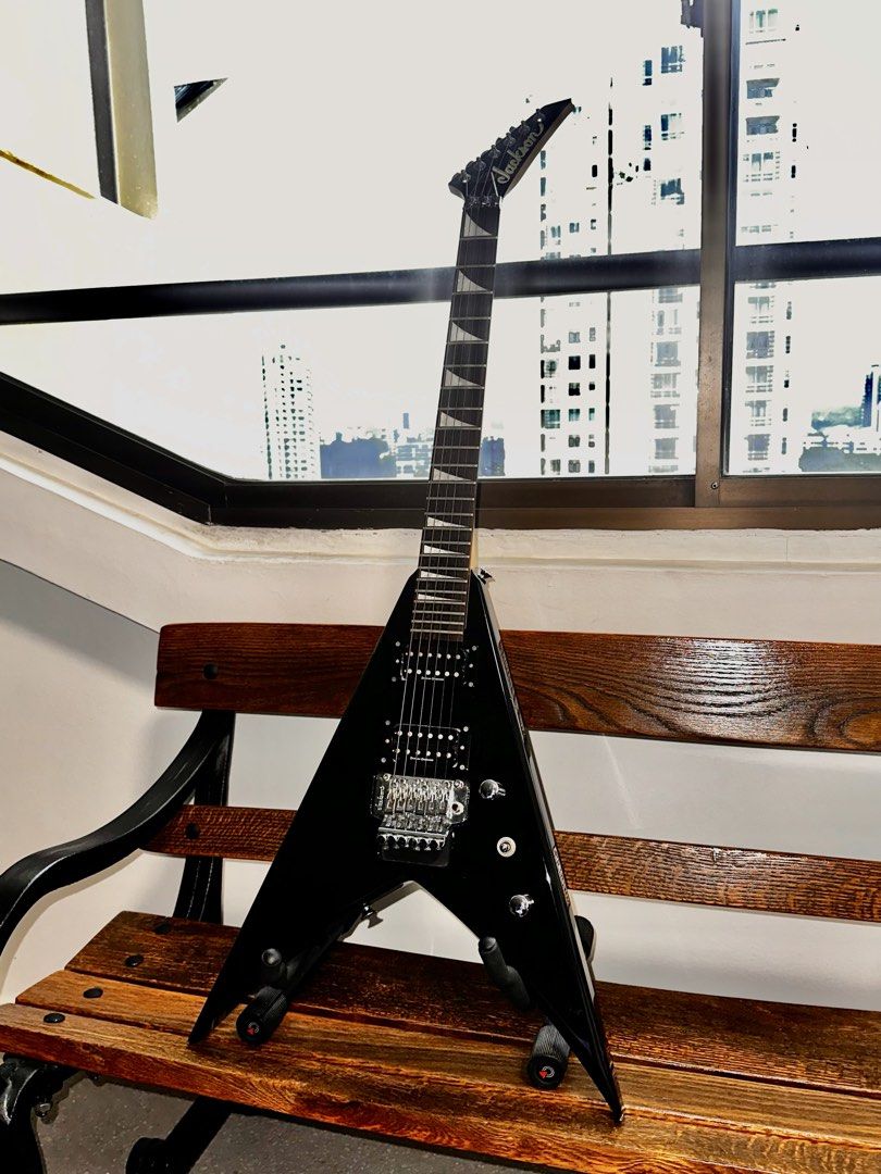 Jackson King V MIJ (Category: Musical Instruments) located in Singapore. Submitted by digsno (Listing ID 1451037708, Image 2). Description: King V Jackson KVX10 (Up to nego but no lowball) Everything in good condition aside from the small dents in the body, and paint chips on the bottom edges and the chip in the headstock. Comes with soft case as well, has a small hole in the top of the case which needs to be sewn. Neck feels brand new, fret life