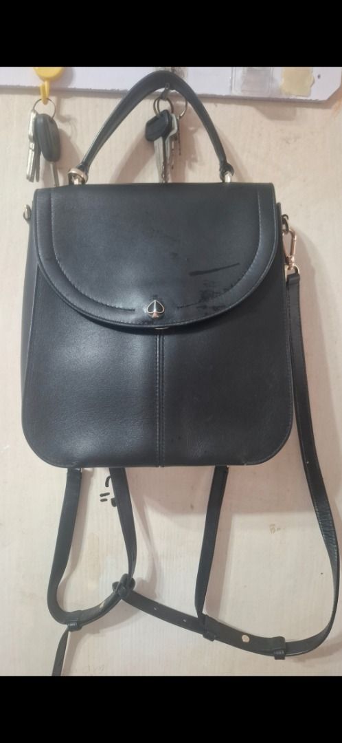 Kate Spade Black Leather Convertible Backpack Handbag (Category: Luxury Bags & Wallets) located in Cavite. Submitted by chinkee0215020 (Listing ID 1450945205, Image 1). Description: - Genuine black leather Kate Spade bag - Convertible: Wear as a backpack or shoulder bag - Additional top handle for carrying options - Multiple interior compartments for organization - Elegant gold hardware - Note: Minor scuffs on the front flap - Interior is clean a