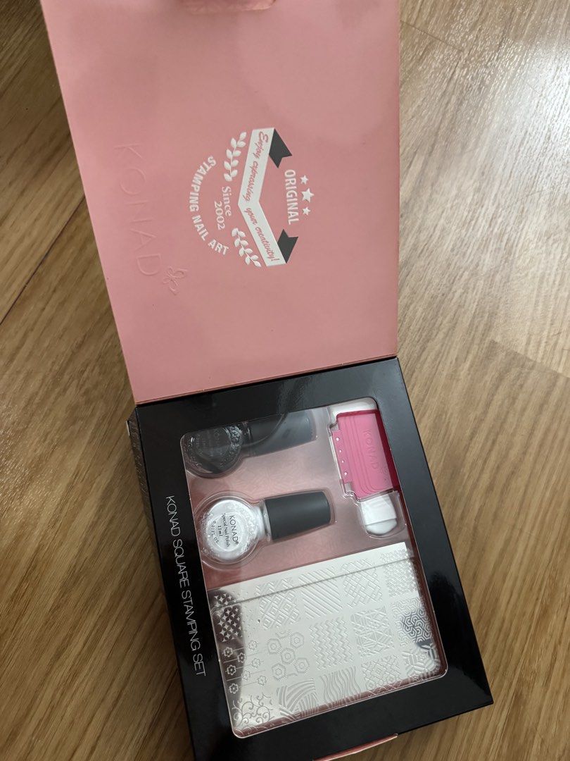 Konad Square Stamping Set Nail Art Kit (Category: Hands & Nails) located in Manila. Submitted by plbranded202627 (Listing ID 1451015404, Image 2). Description: - Easy nail art creation with Konad Square Stamping Set - Includes stamper, scraper, and image plate with various designs - Perfect for DIY manicures - Fun and simple to use - Make your nails stand out!.