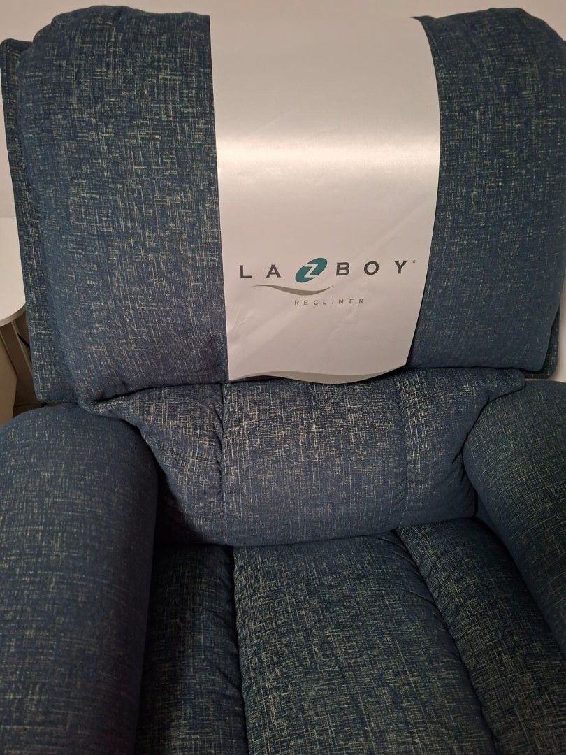 La-Z-Boy Recliner - Blue Fabric (Category: Chairs) located in Taguig. Submitted by kitin1218 (Listing ID 1451040087, Image 2). Description: - Comfortable La-Z-Boy recliner - Nice blue textured fabric - Padded arms and back for extra comfort - Smooth reclining mechanism - Perfect for relaxing after a long day - Fits well in most living rooms - Selling because it's no longer needed -Seldome used 📍Taguig.