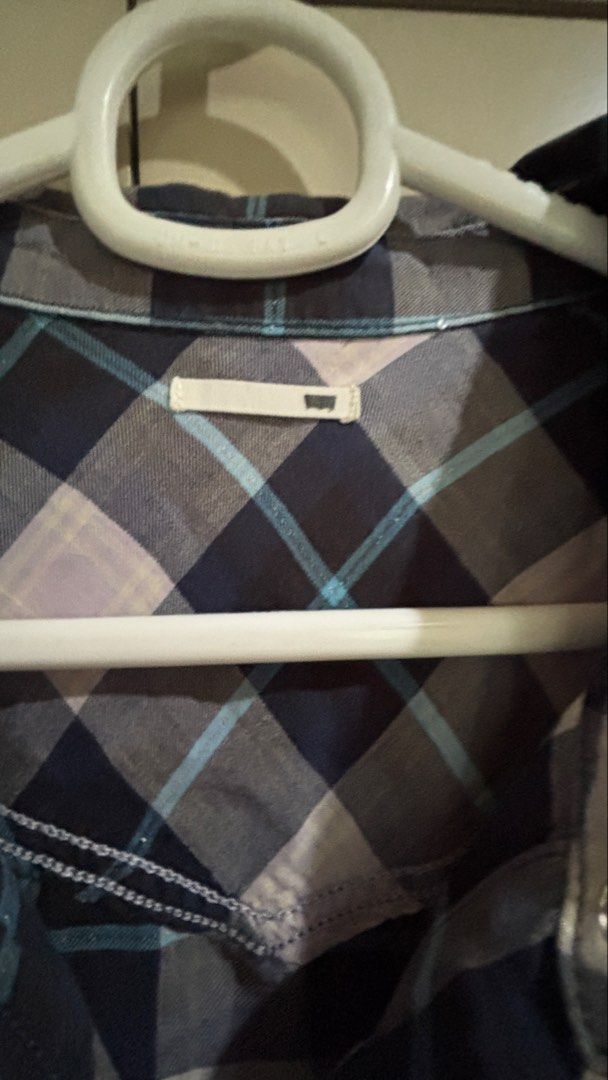 Levi's Plaid Short Sleeve Button Up Shirt (Category: Coats, Jackets and Outerwear) located in Manila. Submitted by daisiestuffph (Listing ID 1451019726, Image 3). Description: - Classic Levi's plaid shirt - Short sleeves - Button-up front - Two chest pockets with button closures - Comfortable cotton blend - Perfect for casual wear.