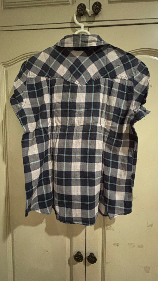 Levi's Plaid Short Sleeve Button Up Shirt (Category: Coats, Jackets and Outerwear) located in Manila. Submitted by daisiestuffph (Listing ID 1451019726, Image 2). Description: - Classic Levi's plaid shirt - Short sleeves - Button-up front - Two chest pockets with button closures - Comfortable cotton blend - Perfect for casual wear.