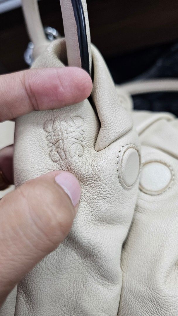 Loewe Beige Leather Hobo Bag (Category: Luxury Bags & Wallets) located in Kibawe. Submitted by Thrift_ni_Babac (Listing ID 1451021160, Image 2). Description: - Loewe Hobo Bag - Made in Spain - Color: Beige - Material: Genuine Leather - Silhouette: Soft, slouchy - Interior: Patterned lining - Features: Embossed Loewe anagram - Hardware: Silver-tone - Style: Chic everyday bag - Issue: See last photo po.