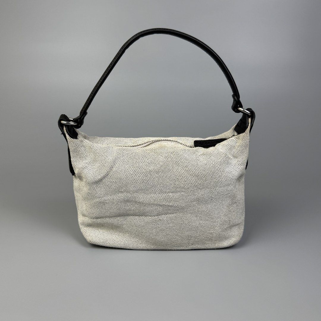 Longchamp - Canvas Mini Essential S Shoulder Bag (Category: Luxury Bags & Wallets) located in Quezon City. Submitted by japon_rose (Listing ID 1451108449, Image 2). Description: READ DESCRIPTION FIRST BEFORE YOU START A DEAL GUARANTEED AUTHENTIC ❗️ Longchamp - Canvas Mini Essential S Shoulder Bag (Hobo Type) Can fit any IPhone + power bank and wallet or etc. Color: Canvas Cream White Dimensions: Length: 6 Width: 11 Side: 3 Under: 4 Strap Drop: 6 