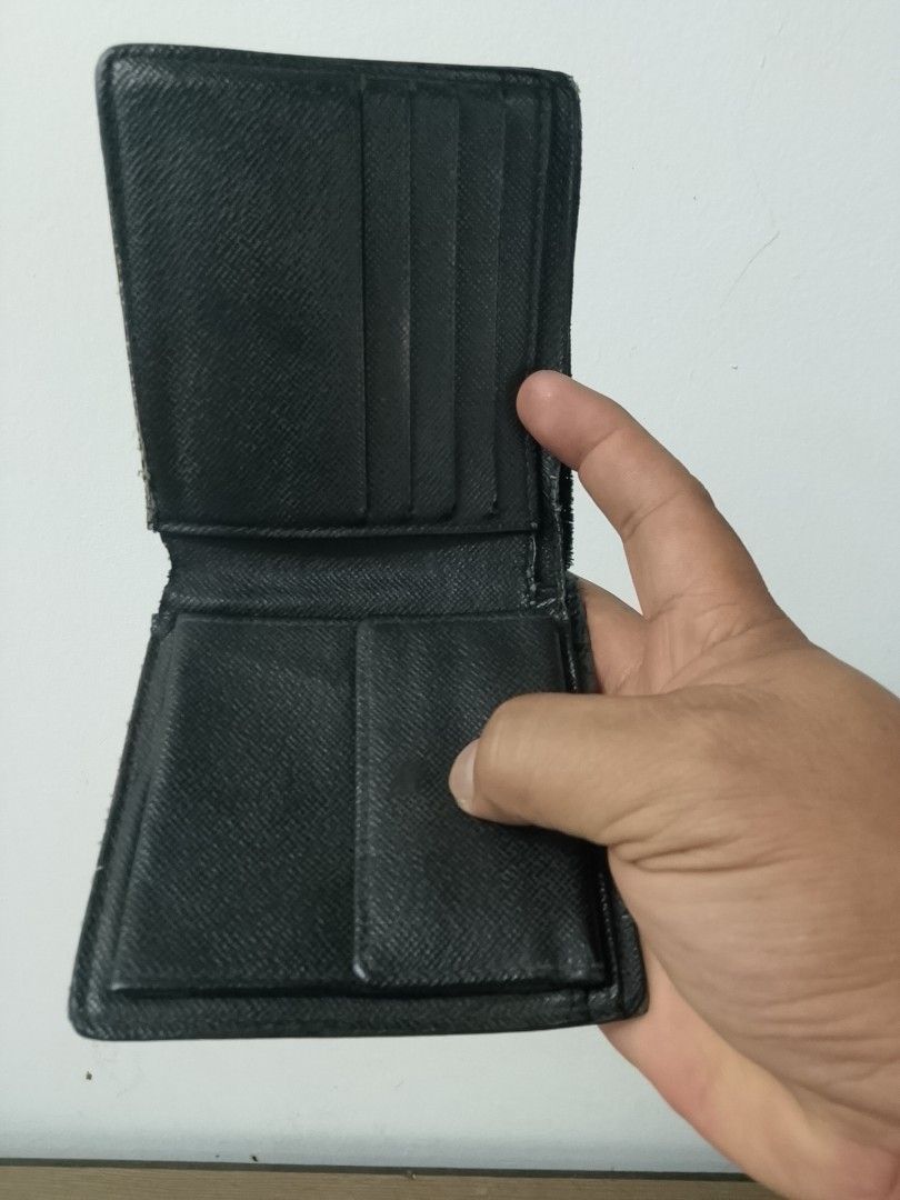 Louis Vuitton Damier Graphite Bifold Wallet (Category: Luxury Bags & Wallets) located in Pasay City. Submitted by gcia86 (Listing ID 1450999691, Image 3). Description: - WELL USED - PRICE IS VERY NEGOTIABLE - Authentic Louis Vuitton Wallet - Damier Graphite Canvas - Bifold Design - Multiple Card Slots & Bill Compartments - Fully functional and stylish - Ideal for everyday carry .