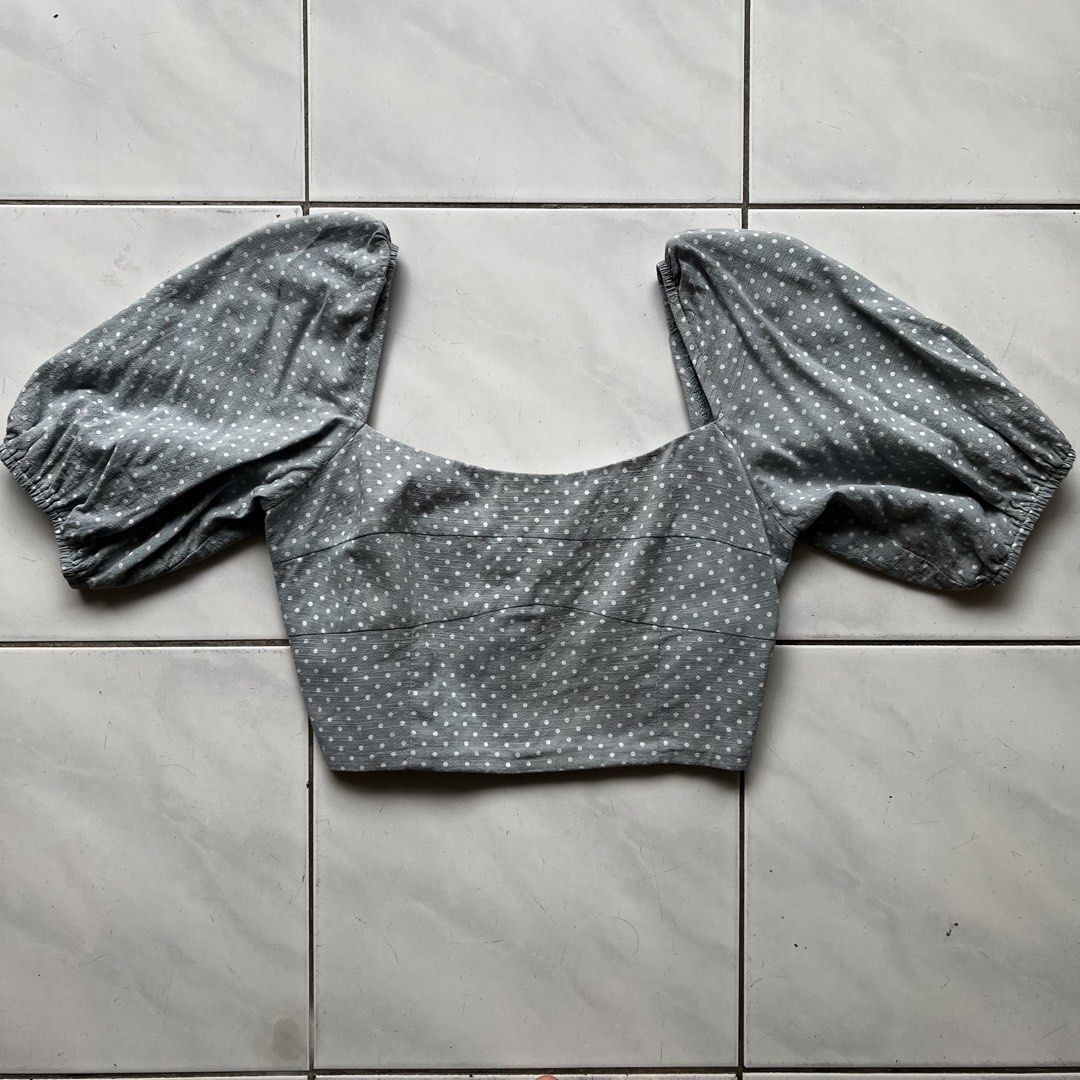 Love, Bonito Polka Dot Puff Sleeve Square Neck Crop Top (Category: Blouses) located in Subang Jaya. Submitted by ilepflower (Listing ID 1451035349, Image 1). Description: Laid flat measurements Bust: 42cm Waist: 33cm Length: 36cm - Light blue crop top - White polka dot pattern - Puffy sleeves - Square neckline - Smocked back for a snug fit - Versatile: pair with jeans or skirts - Ideal for casual days or nights out.