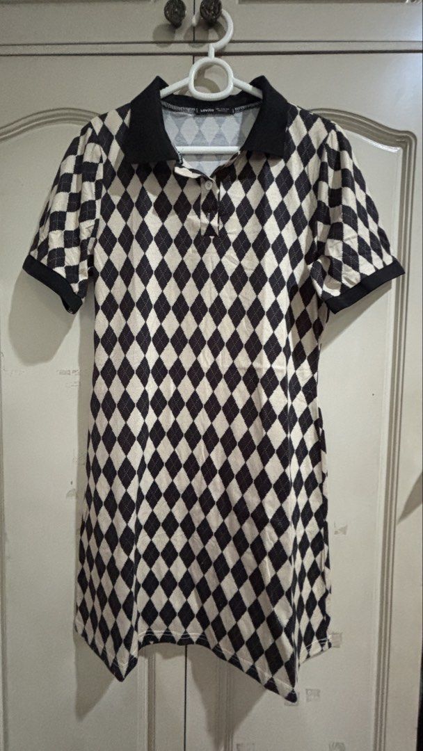 Lovito Argyle Polo Dress (Category: Dresses) located in Manila. Submitted by daisiestuffph (Listing ID 1451020167, Image 1). Description: - Lovito polo dress - Black and cream argyle pattern - Short sleeves with collar - Estimated size L - Versatile for casual or dressy occasions - Easy to wear.