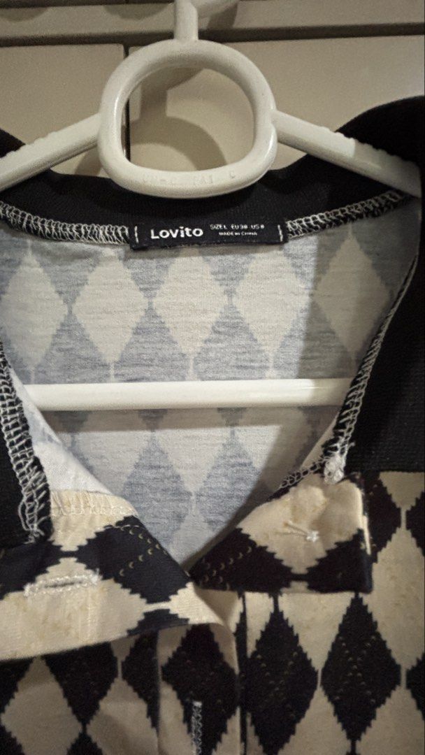 Lovito Argyle Polo Dress (Category: Dresses) located in Manila. Submitted by daisiestuffph (Listing ID 1451020167, Image 3). Description: - Lovito polo dress - Black and cream argyle pattern - Short sleeves with collar - Estimated size L - Versatile for casual or dressy occasions - Easy to wear.
