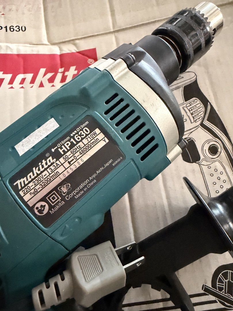 Makita Hammer Drill 16mm (Category: Construction Tools & Equipment) located in Manila. Submitted by danipoli (Listing ID 1450967051, Image 3). Description: Original Makita Hammer Drill Electric drill 16mm HIGHLIGHTS: High power 710W motor Ergonomically designed handle with rubberized soft grip Sturdy cylinder-shaped motor housing. Built-in, shock-proof, high-output Ball bearing construction for longer tool life Rubberized comfort grip for more co