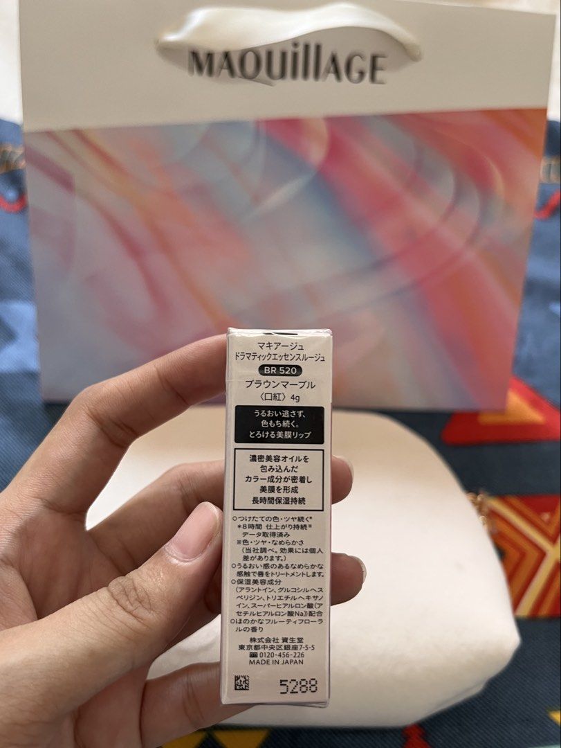 MAQuillAGE Brown Marble Dramatic Essence Rouge Lipstick & Pouch (Category: Makeup) located in Cavite. Submitted by myprsnlpreloved (Listing ID 1450977528, Image 2). Description: - Bought in Japan - MAQuillAGE Dramatic Essence Rouge Lipstick - Brand new and sealed - Shade: BR 520r Brown Marble - Limited Edition: 20th Anniversary - Includes: Soft, cream-colored MAQuillAGE makeup pouch - Lipstick Net Weight: 4g.