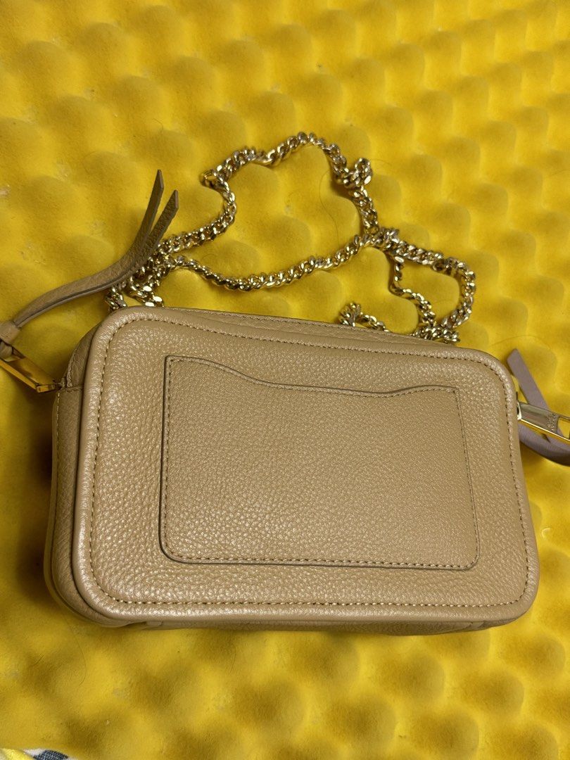 Marc Jacobs Snapshot Camera Bag Beige Leather Gold Hardware (Category: Luxury Bags & Wallets) located in Las Pinas. Submitted by al0704 (Listing ID 1450975268, Image 2). Description: - Authentic Marc Jacobs Snapshot Bag - Color: Beige - Material: Pebbled Leather - Hardware: Gold - Includes: Original Tags, Dust Bag - Strap: Detachable Chain Strap - Versatile: Ideal for everyday use or nights out - Spacious: Ample room for essentials.