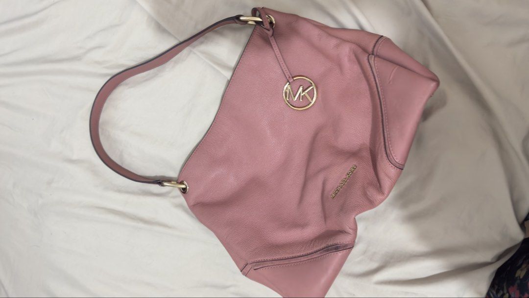 Michael Kors Pink Leather Shoulder Bag (Category: Luxury Bags & Wallets) located in Manila. Submitted by mschasaha60513 (Listing ID 1451055661, Image 1). Description: - Authentic Michael Kors shoulder bag - Lovely pink leather - Gold hardware - Single strap - Multiple interior pockets for organization - Embossed MK logo and brand name - Ideal for everyday use.