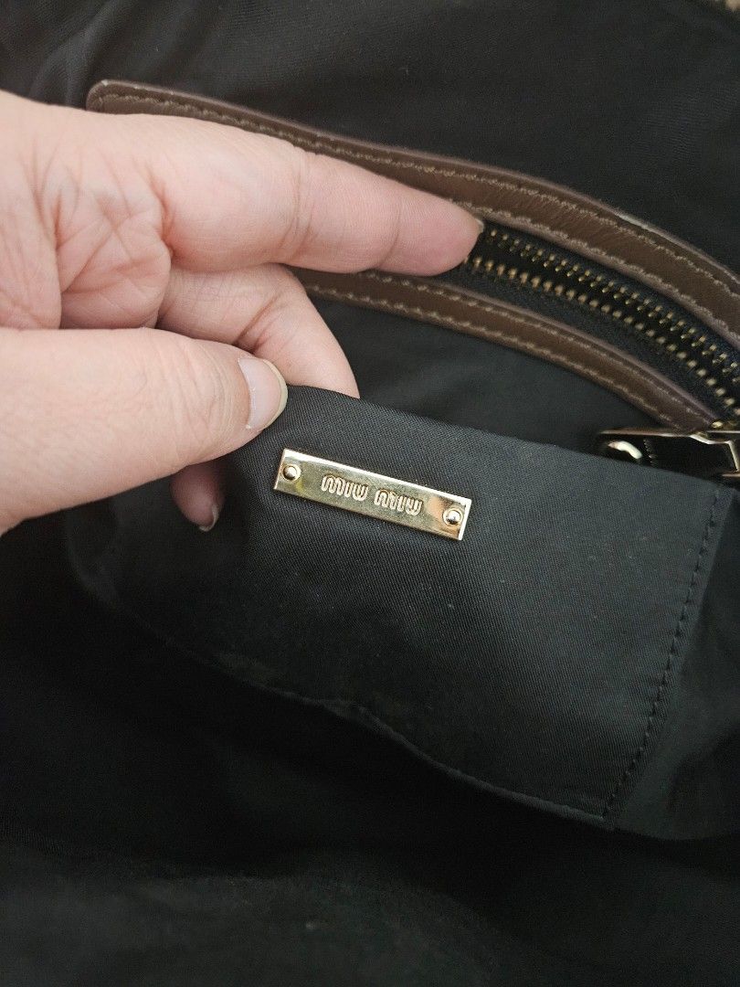 MiuMiu (Category: Luxury Bags & Wallets) located in Pasig City. Submitted by luxefab.finds (Listing ID 1451130946, Image 3). Description: MiuMiu * 🇰🇷 preloved * no sling * missing code Rfs: decluttering; too many bags If interested, feel free to make an offer 😀 No to joy reservers please. thanks!.